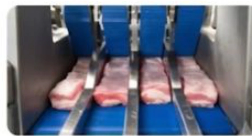 Automated shingling and stacking of sliced meat